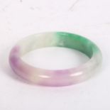 A coloured jadite bangle, internal width 6cm