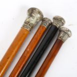 4 walking canes with silver and white metal knops
