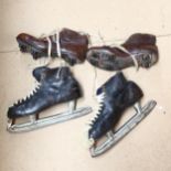 A pair of ice skates, and a pair of Vintage leather football boots