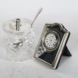 R Carr small silver-fronted clock and a preserve jar and cover, plated lid