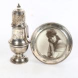 A George V silver sugar caster, Birmingham 1915, and a circular silver-fronted photo frame (2)