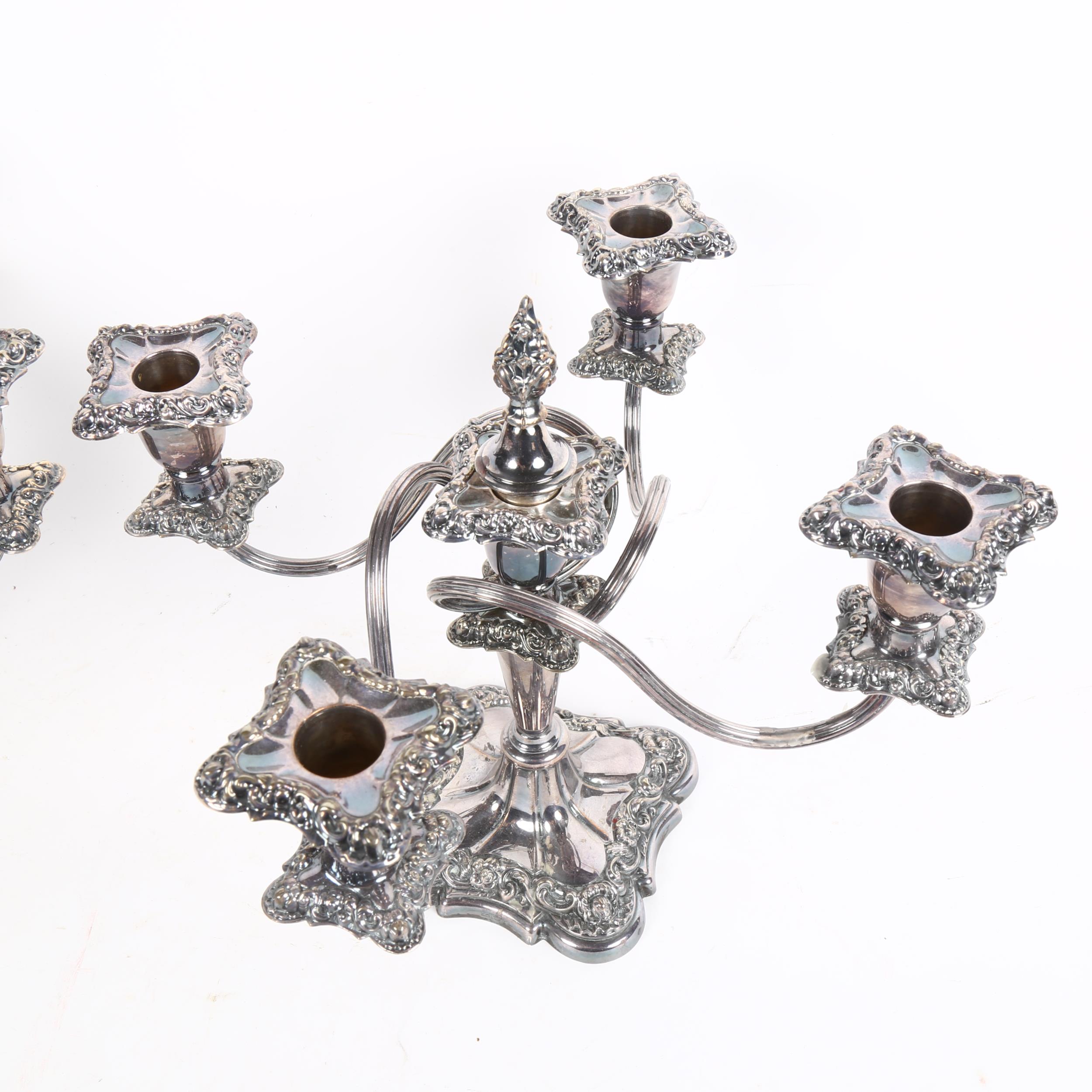 A pair of silver plate on copper 4-branch table candelabras, with embossed decoration, height 26cm - Image 2 of 2