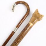 A silver tipped and silver collared walking stick, initials H L on silver collar, a walking staff