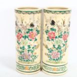 A pair of Chinese porcelain cylinder vases with painted enamel birds and flowers, signed, height
