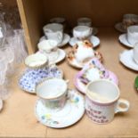 A group of 9 moustache cups and saucers, and mug