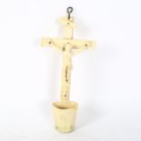 An 18th century carved bone crucifix, length 22cm The base has a small chip on the rim otherwise all