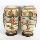 A pair of large Japanese Satsuma cylinder vases, with applied Geisha and gilded decoration, on