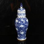 A Chinese blue and white baluster jar and cover, height 34cm Top rim has a faint 4cm hairline crack,