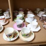 A group of 11 moustache cups and saucers and mugs, including Goudhurst souvenir and Wedgwood