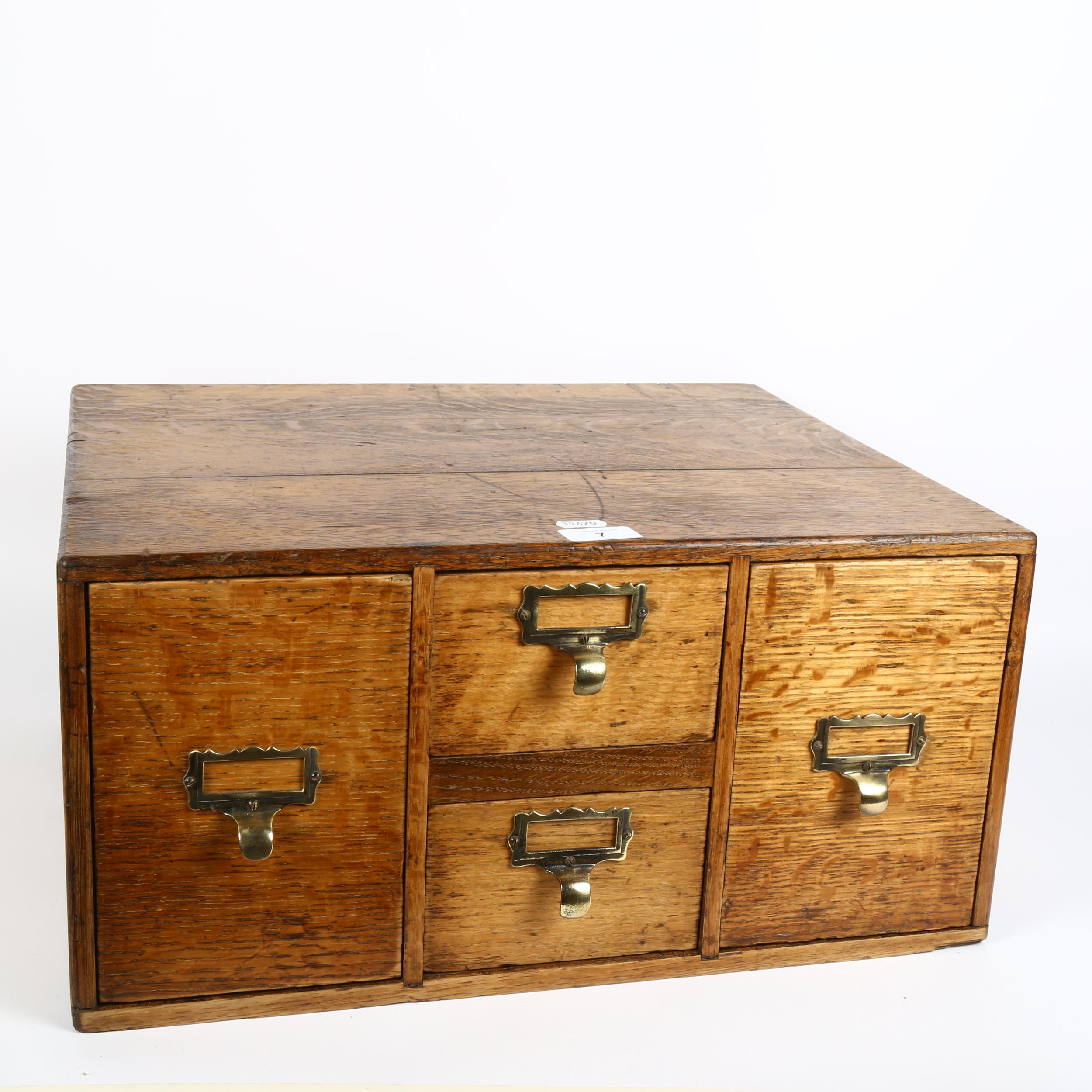 An early 20th century light oak index filing cabinet, W49cm, H24cm, D40cm