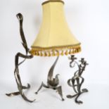 A sculptural metal table lamp, on tripod base, with shade, height 70cm, a wrought-metal 3-branch