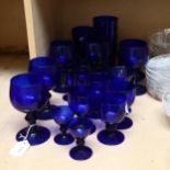 A collection of Bristol blue glasses, including wine goblets and tumblers