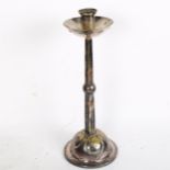 A highly stylised silver plate on copper Arts and Crafts single candlestick, height 26.5cm, the base