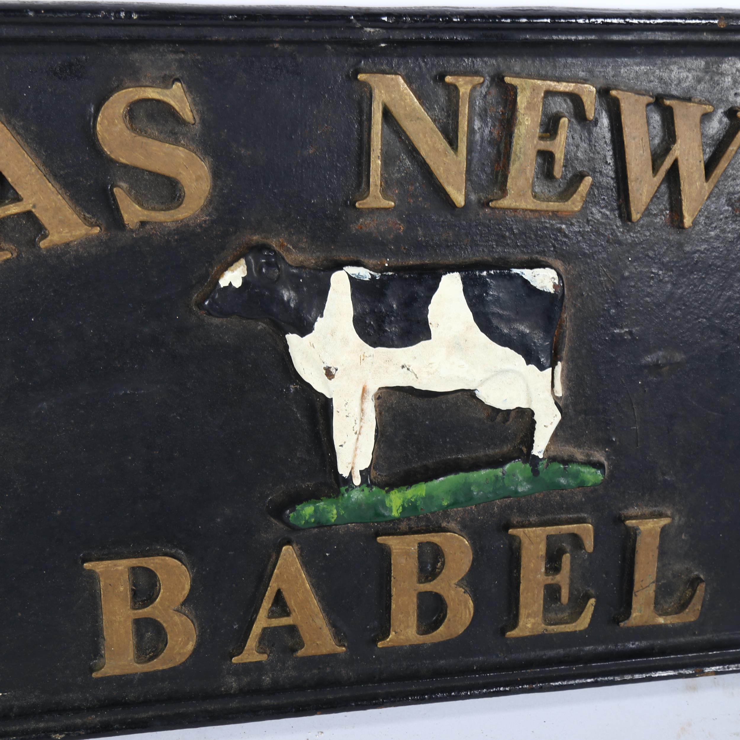 A cast-iron Plaz Newydd Babel dairy advertising sign, 29cm x 60cm - Image 2 of 2