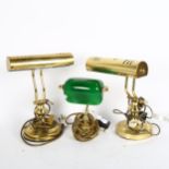 A pair of brass desk lamps with adjustable brass shades, height 33cm, and a smaller lamp with