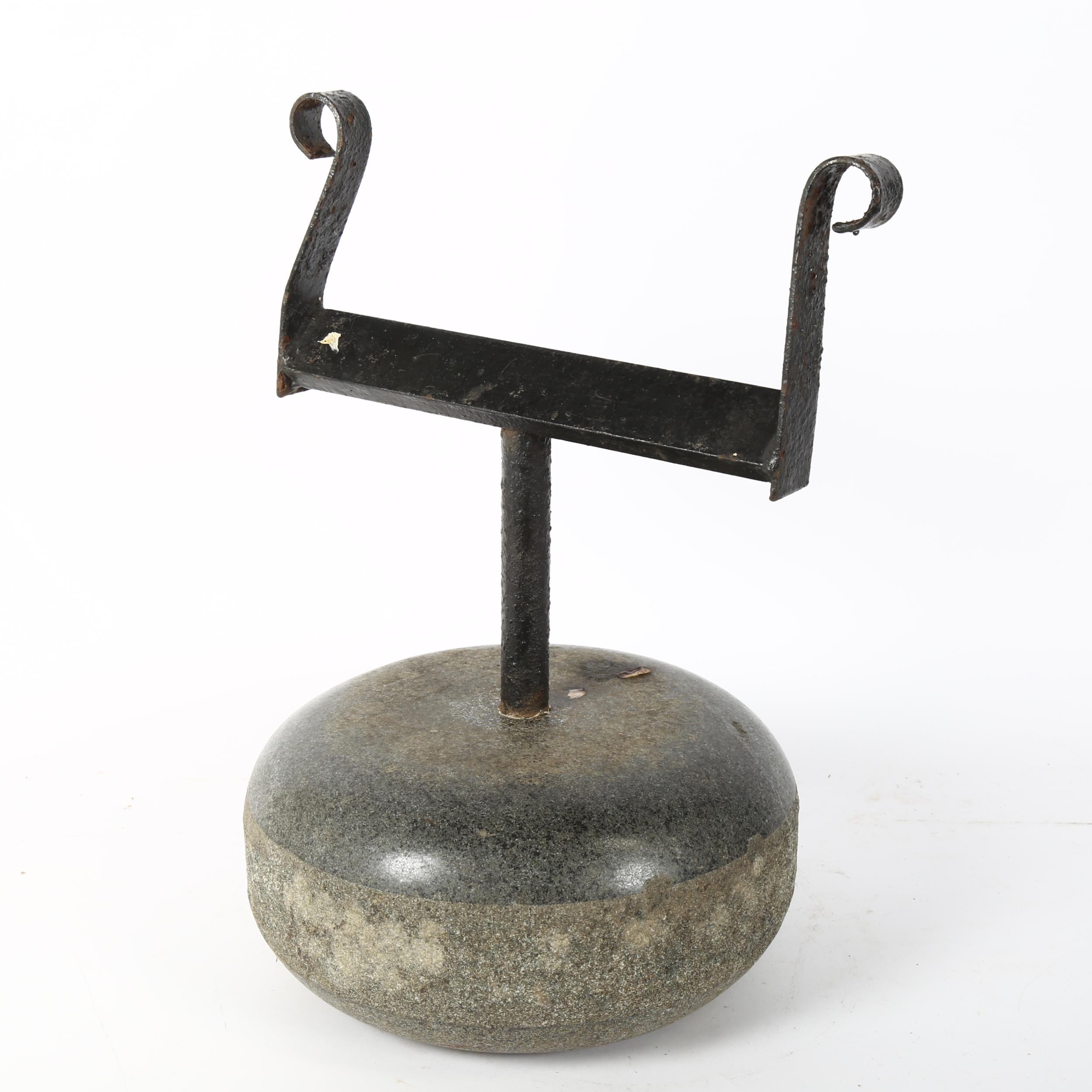 A Scottish granite curling stone boot scraper, height 40cm