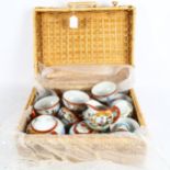 A Japanese eggshell porcelain tea set in hamper