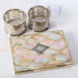 A Victorian mother-of-pearl card case, length 10.5cm, and a pair of pierced silver napkin rings
