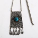 A silver filigree and turquoise set panel pendant necklace and chain