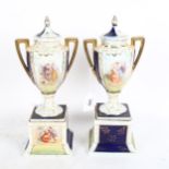 A pair of Austrian porcelain 2-handled urns and covers on plinths, height 31cm