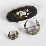 A silver and Pietra Dura brooch of oval form, and 2 silver and paste set crescent design brooches (