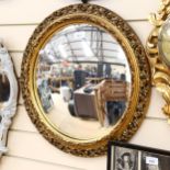 Vintage circular convex wall mirror, in embossed and pierced gilt frame, height 52cm