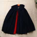 A Spanish cape with red velvet trim, length 110cm