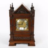 A German mantel clock with 2-train movement and carved oak case, 39cm