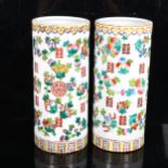 A pair of Chinese famille verte fruit cylinder vases, marks on bases, height 28cm No chips cracks or