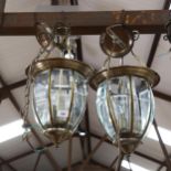 A pair of brass ovoid ceiling lanterns