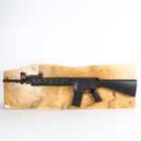 Clive Fredriksson, Stoner rifle mounted on wood, 29cm x 99cm