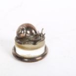 A French silver and glass paperweight, surmounted by a snail, impressed to the underside Ercuis
