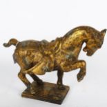 A gilded cast-metal Tang style horse, height 27cm