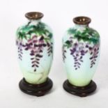 A pair of small Chinese cloisonne vases, with character marks to the base, height 9cm, on turned