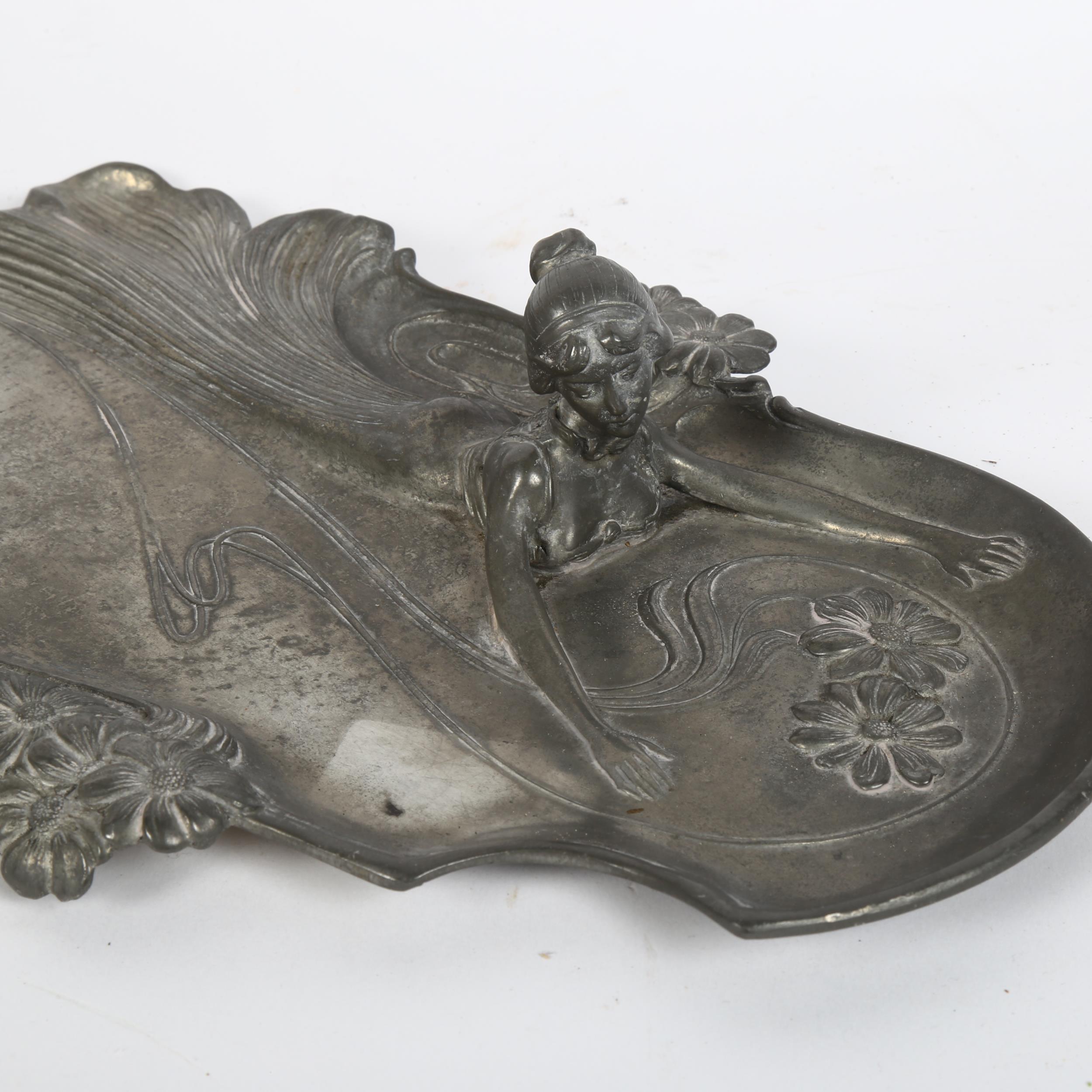 An Art Nouveau pewter figural dish, and another aluminium dish, largest length 37cm (2) - Image 2 of 2