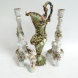 A pair of Vienna porcelain candlesticks, with flower encrusted decoration, height 33cm, and an