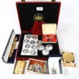 A collection of 50p Jubilee encapsulated coins, a silver and enamel charm bracelet, costume