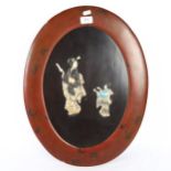 An Oriental oval lacquered panel, with applied and painted figures, height 53cm