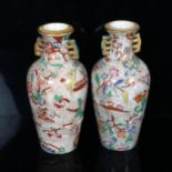 A pair of 19th century chinoiserie transfer printed vases with gilded neck handles, no factory