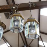 A pair of brass bevel-edge lanterns