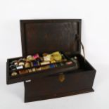 A stained wood sewing box, with tray-fitted interior and contents, 41cm across