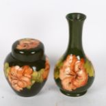Moorcroft green ground vase with orchid decoration, 15cm, and a matching jar and cover