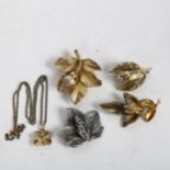 4 silver-gilt leaf design brooches, and another