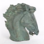 An Austins productions verdigris plaster horse's head, height 30cm