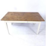 A polished pine top farmhouse kitchen table, on painted base, L147cm, H74cm, D84cm