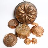 A group of copper jelly moulds