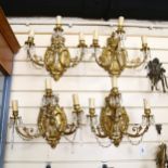 A set of 4 ornate gilt-brass wall light fittings, with lustre drops and triple sconce, height 32cm