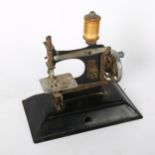 A child's Vintage sewing machine, length 16cm