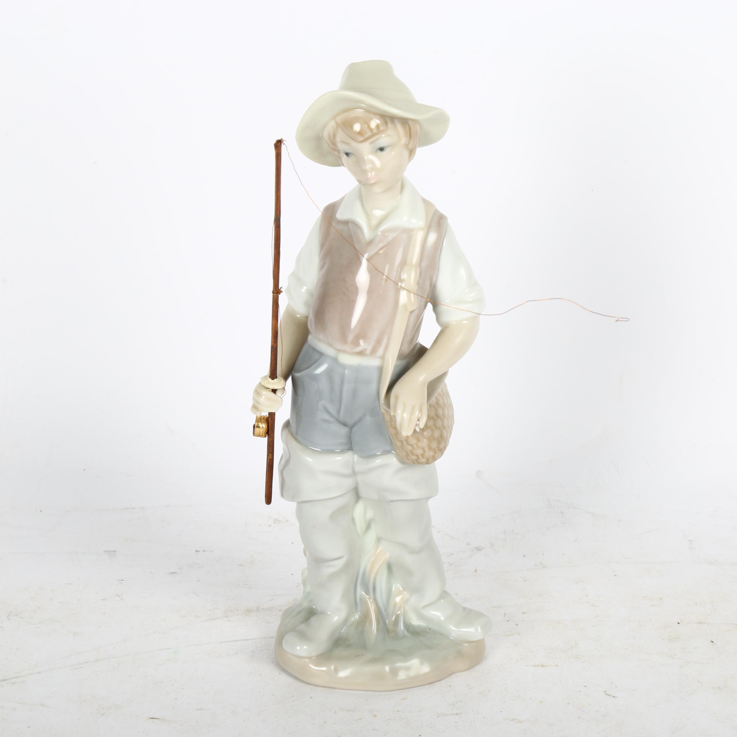 Lladro boy angler (A/F), 21cm