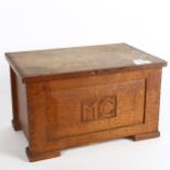 An early 20th century Gothic style oak jewellery box, with fitted inner tray, with monogrammed